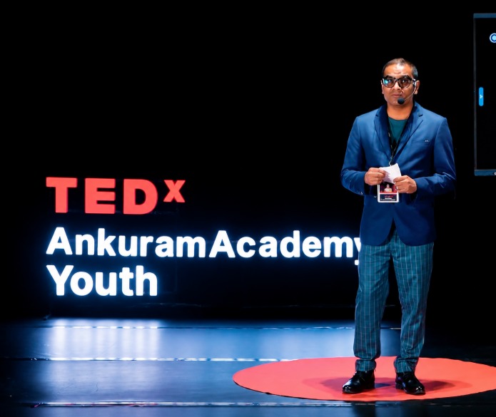 Dr. Krishna Khanal speaking at TEDx AnkuramAcademy